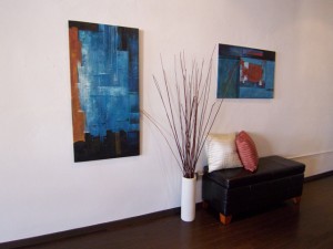 Entry We moved the bench from the foot of the bed into the entry and added art and a floor vase to warm up this space and invite buyers in.