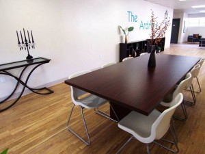 Entry & Conference Area: notice the creative use of a vinyl wall decal as an accessory. This "candelabra" sits atop the console table as residents enter the space.
