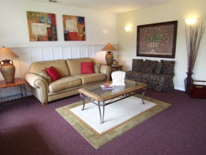 LRAfter1 Paint, art, throw pillows and some new ottomans warm up what was a lackluster rarely-used space