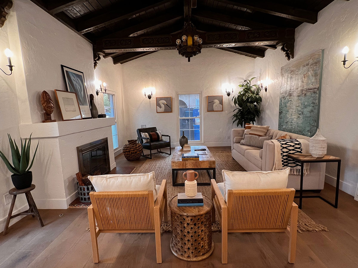 Rustic living room with with dark decorative wood ceiling.