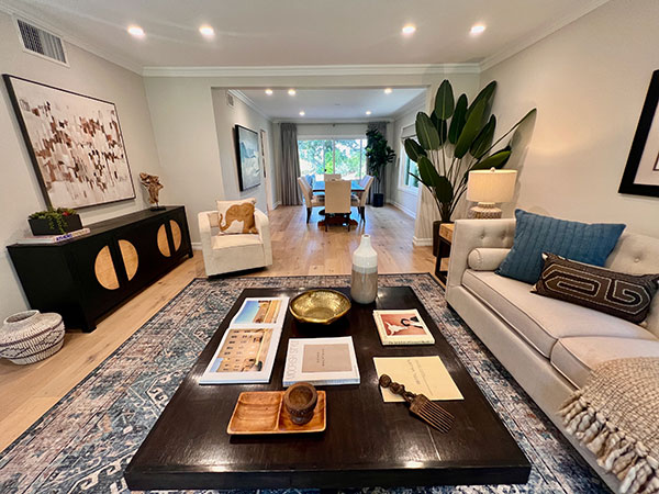 Home staged space with desk and chair on wood flooring.